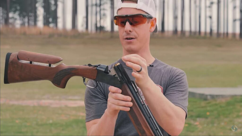 Man holding Stoeger Grand with Adjustable Comb